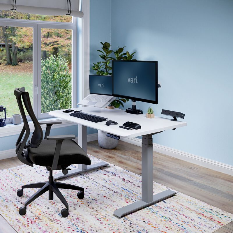 Electric Standing Desk with ComfortEdge in 48x30 White in lowered position at home image number null